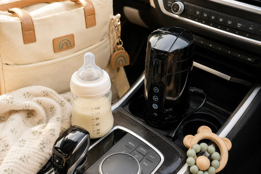 Portable bottle warmer connected inside a modern car with a baby bottle, diaper bag, and baby essentials for travel feeding.